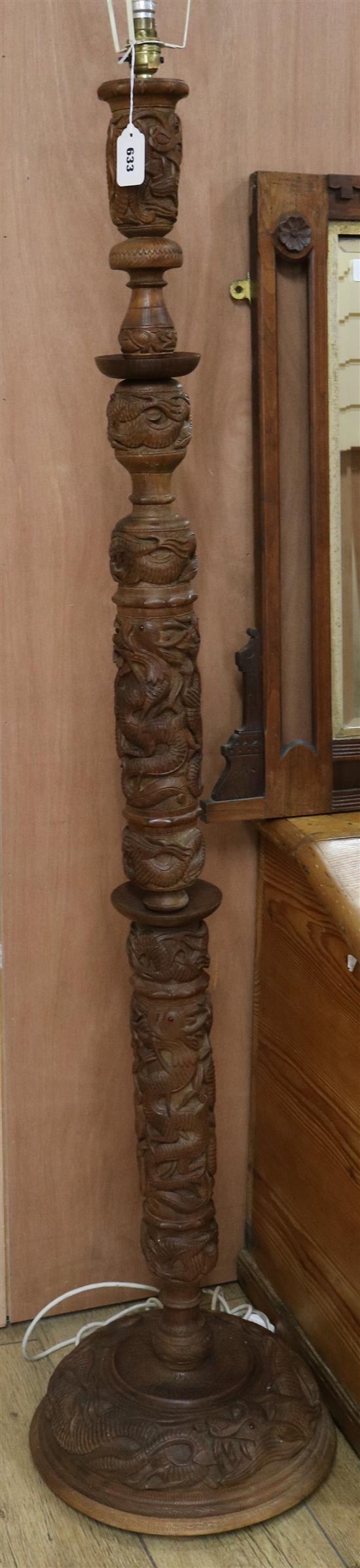 A carved Burmese standard lamp, H.170cm